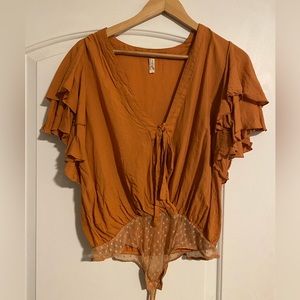 Free People Burnt Orange Ruffle Sleeve Body Suit